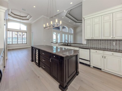One or more photo(s) has been virtually staged. Waterfront on Bird Bay Executive Golf Club in Florida - for sale on GolfHomes.com, golf home, golf lot