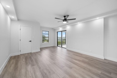 Step into luxury in this fully remodeled 2-bed, 2-bath corner on Marina Lakes Golf Course in Florida - for sale on GolfHomes.com, golf home, golf lot