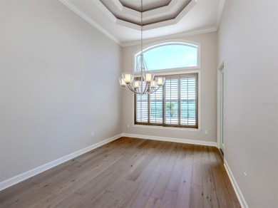 One or more photo(s) has been virtually staged. Waterfront on Bird Bay Executive Golf Club in Florida - for sale on GolfHomes.com, golf home, golf lot