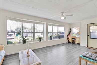 Inviting layout with lots of windows and open floor plan. The on Barefoot Bay Golf Course in Florida - for sale on GolfHomes.com, golf home, golf lot