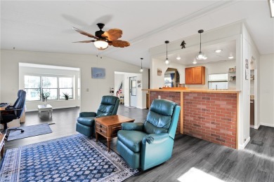 Inviting layout with lots of windows and open floor plan. The on Barefoot Bay Golf Course in Florida - for sale on GolfHomes.com, golf home, golf lot