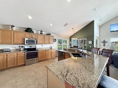 Welcome to this beautiful two-story home nestled inside the on Oaks National Golf Course in Florida - for sale on GolfHomes.com, golf home, golf lot