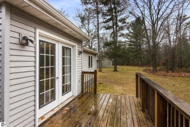 Nestled on a spacious, wooded lot, this welcoming home combines on Twin Birch Golf Club in Michigan - for sale on GolfHomes.com, golf home, golf lot