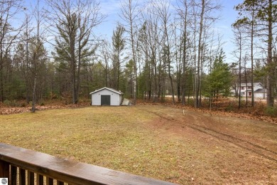 Nestled on a spacious, wooded lot, this welcoming home combines on Twin Birch Golf Club in Michigan - for sale on GolfHomes.com, golf home, golf lot