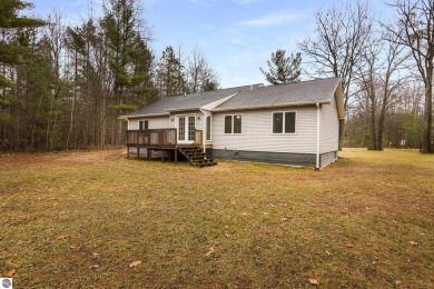 Nestled on a spacious, wooded lot, this welcoming home combines on Twin Birch Golf Club in Michigan - for sale on GolfHomes.com, golf home, golf lot