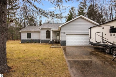 Nestled on a spacious, wooded lot, this welcoming home combines on Twin Birch Golf Club in Michigan - for sale on GolfHomes.com, golf home, golf lot