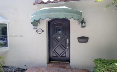 Step into timeless elegance in this classic Miami Beach home on Miami Beach Golf Club in Florida - for sale on GolfHomes.com, golf home, golf lot