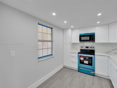 Discover luxurious living in this fully renovated 3-bedroom on Palm-Aire Country Club and Resort - The Oaks in Florida - for sale on GolfHomes.com, golf home, golf lot