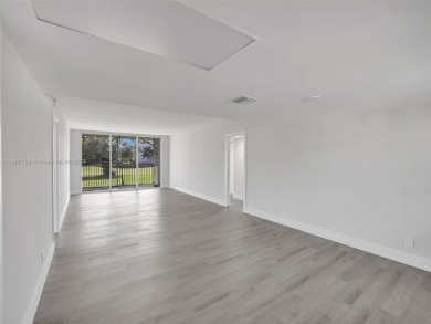 Discover luxurious living in this fully renovated 3-bedroom on Palm-Aire Country Club and Resort - The Oaks in Florida - for sale on GolfHomes.com, golf home, golf lot