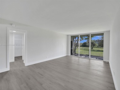 Discover luxurious living in this fully renovated 3-bedroom on Palm-Aire Country Club and Resort - The Oaks in Florida - for sale on GolfHomes.com, golf home, golf lot