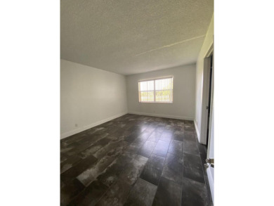 Step into this spacious condo, ideally situated on the 3rd floor on Boca Dunes Golf and Country Club in Florida - for sale on GolfHomes.com, golf home, golf lot