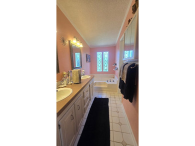 Welcome to this beautifully maintained and fully remodeled home on Hamptons Golf Club in Florida - for sale on GolfHomes.com, golf home, golf lot