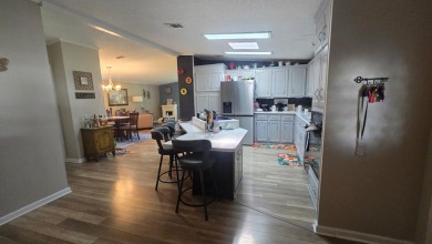Welcome to this beautifully maintained and fully remodeled home on Hamptons Golf Club in Florida - for sale on GolfHomes.com, golf home, golf lot