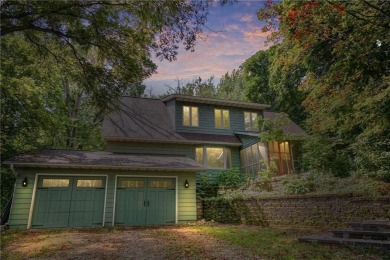 Nestled on 6 serene woodland acres, this house harmoniously on Faribault Golf and Country Club in Minnesota - for sale on GolfHomes.com, golf home, golf lot