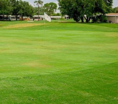 Welcome to this beautifully maintained and fully remodeled home on Hamptons Golf Club in Florida - for sale on GolfHomes.com, golf home, golf lot