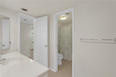 Come cozy up in this charming condo boasting picturesque lake on Vista Plantation Golf Club in Florida - for sale on GolfHomes.com, golf home, golf lot