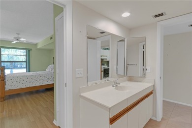 Come cozy up in this charming condo boasting picturesque lake on Vista Plantation Golf Club in Florida - for sale on GolfHomes.com, golf home, golf lot