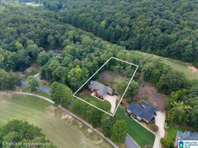 Welcome to this stunning 4-bedroom, 3-bath home located in on Heritage Green  Golf Course in Alabama - for sale on GolfHomes.com, golf home, golf lot