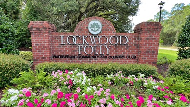 Build your dream home on this spacious lot overlooking the lush on Lockwood Folly Country Club in North Carolina - for sale on GolfHomes.com, golf home, golf lot