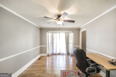 This beautifully updated home is located in a private gated on Canongate At Healy Point Country Club in Georgia - for sale on GolfHomes.com, golf home, golf lot
