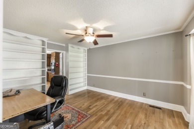 This beautifully updated home is located in a private gated on Canongate At Healy Point Country Club in Georgia - for sale on GolfHomes.com, golf home, golf lot