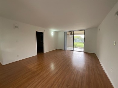 Beautiful 2BD/2BA condo in the peaceful Palm Springs 3 community on Oriole Golf and Tennis Club in Florida - for sale on GolfHomes.com, golf home, golf lot