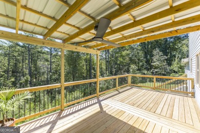 This beautifully updated home is located in a private gated on Canongate At Healy Point Country Club in Georgia - for sale on GolfHomes.com, golf home, golf lot