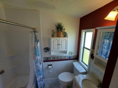 This beautiful home is loaded with upgrades. Both bathrooms have on Lakes at Leesburg Golf Course in Florida - for sale on GolfHomes.com, golf home, golf lot