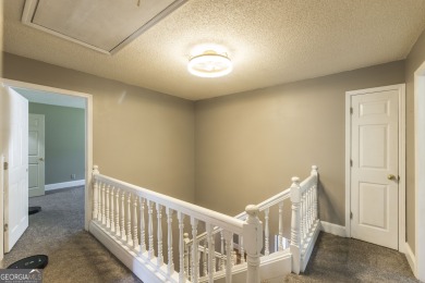 This beautifully updated home is located in a private gated on Canongate At Healy Point Country Club in Georgia - for sale on GolfHomes.com, golf home, golf lot