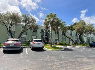 Beautiful 2BD/2BA condo in the peaceful Palm Springs 3 community on Oriole Golf and Tennis Club in Florida - for sale on GolfHomes.com, golf home, golf lot