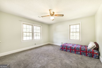 This beautifully updated home is located in a private gated on Canongate At Healy Point Country Club in Georgia - for sale on GolfHomes.com, golf home, golf lot