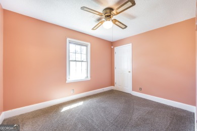 This beautifully updated home is located in a private gated on Canongate At Healy Point Country Club in Georgia - for sale on GolfHomes.com, golf home, golf lot
