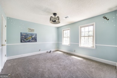 This beautifully updated home is located in a private gated on Canongate At Healy Point Country Club in Georgia - for sale on GolfHomes.com, golf home, golf lot