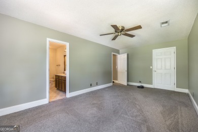 This beautifully updated home is located in a private gated on Canongate At Healy Point Country Club in Georgia - for sale on GolfHomes.com, golf home, golf lot