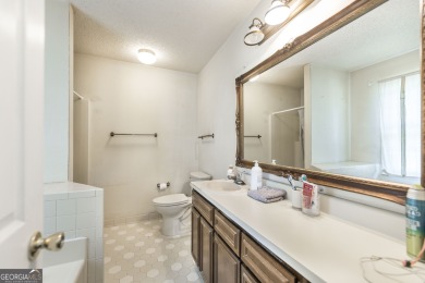 This beautifully updated home is located in a private gated on Canongate At Healy Point Country Club in Georgia - for sale on GolfHomes.com, golf home, golf lot