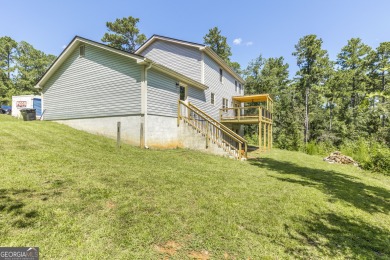 This beautifully updated home is located in a private gated on Canongate At Healy Point Country Club in Georgia - for sale on GolfHomes.com, golf home, golf lot