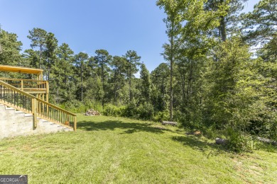 This beautifully updated home is located in a private gated on Canongate At Healy Point Country Club in Georgia - for sale on GolfHomes.com, golf home, golf lot