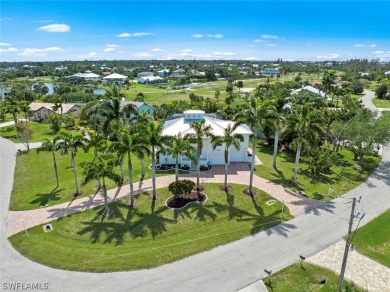 The circular driveway and enormous Royal Palms welcome you as on Alden Pines Golf Club in Florida - for sale on GolfHomes.com, golf home, golf lot