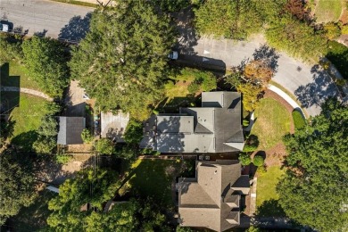 This meticulously maintained Tudor idyllically located in on Druid Hills Golf Club in Georgia - for sale on GolfHomes.com, golf home, golf lot