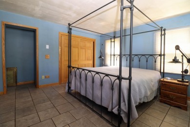 Surrounded by lakes and located on a golf course, this home is on Nippersink Golf Resort in Wisconsin - for sale on GolfHomes.com, golf home, golf lot