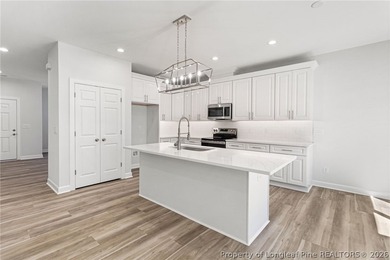 Stunning new construction located in the sought-after, guarded on Carolina Trace Country Club in North Carolina - for sale on GolfHomes.com, golf home, golf lot