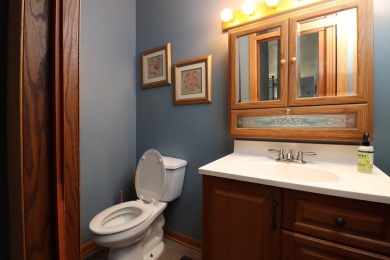 Surrounded by lakes and located on a golf course, this home is on Nippersink Golf Resort in Wisconsin - for sale on GolfHomes.com, golf home, golf lot