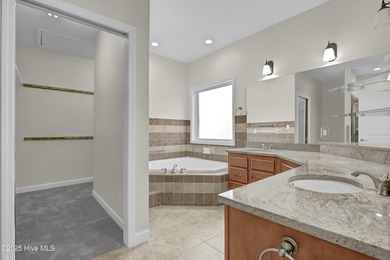 Welcome to this custom-built brick home with an open floor plan on Olde Point Golf and Country Club in North Carolina - for sale on GolfHomes.com, golf home, golf lot