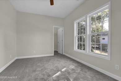 Welcome to this custom-built brick home with an open floor plan on Olde Point Golf and Country Club in North Carolina - for sale on GolfHomes.com, golf home, golf lot