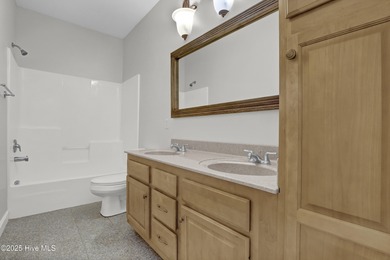 Welcome to this custom-built brick home with an open floor plan on Olde Point Golf and Country Club in North Carolina - for sale on GolfHomes.com, golf home, golf lot