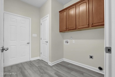 Welcome to this custom-built brick home with an open floor plan on Olde Point Golf and Country Club in North Carolina - for sale on GolfHomes.com, golf home, golf lot