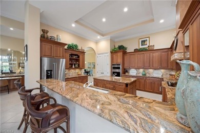 Stunning 3 BR, 3.5 BA home situated on a spectacular lakefront on Pelican Marsh Golf Club in Florida - for sale on GolfHomes.com, golf home, golf lot