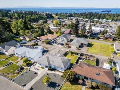 This beautifully maintained 3-bedroom, 3-bathroom residence on Peninsula Golf Club Inc. in Washington - for sale on GolfHomes.com, golf home, golf lot