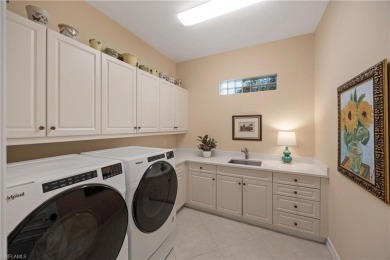 Stunning 3 BR, 3.5 BA home situated on a spectacular lakefront on Pelican Marsh Golf Club in Florida - for sale on GolfHomes.com, golf home, golf lot
