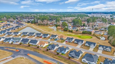 Welcome to low-maintenance coastal living at its finest! This on Palmetto Greens Golf and Country Club in South Carolina - for sale on GolfHomes.com, golf home, golf lot
